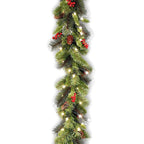 Christmas garland with lights, pinecones, and berries on a white background