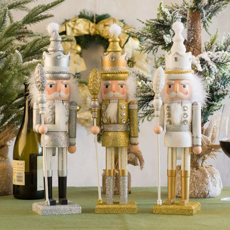 Three decorative nutcrackers on a table with Christmas decorations in the background