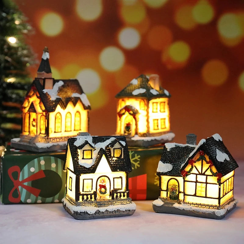 Set of four illuminated miniature Christmas houses with a festive background.