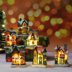 Set of illuminated miniature houses with a festive background