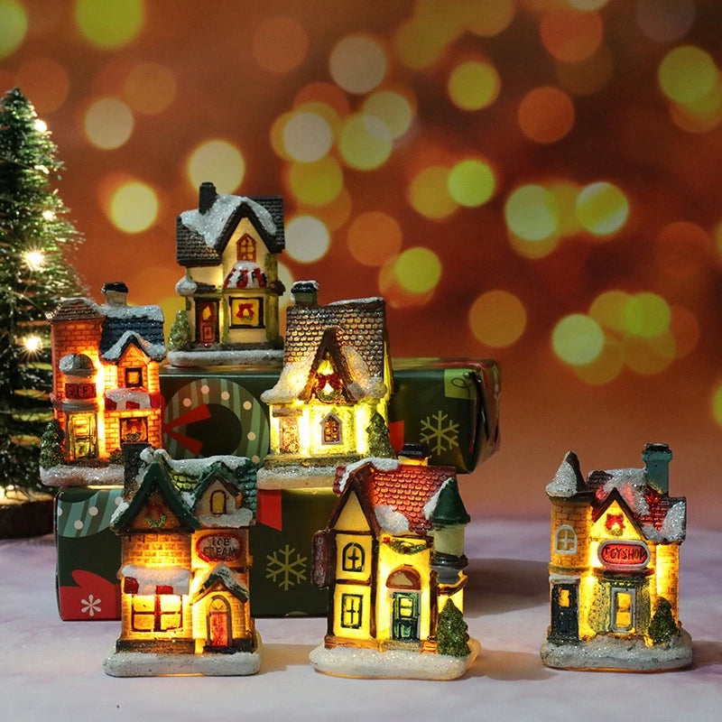 Set of illuminated miniature houses with a festive background