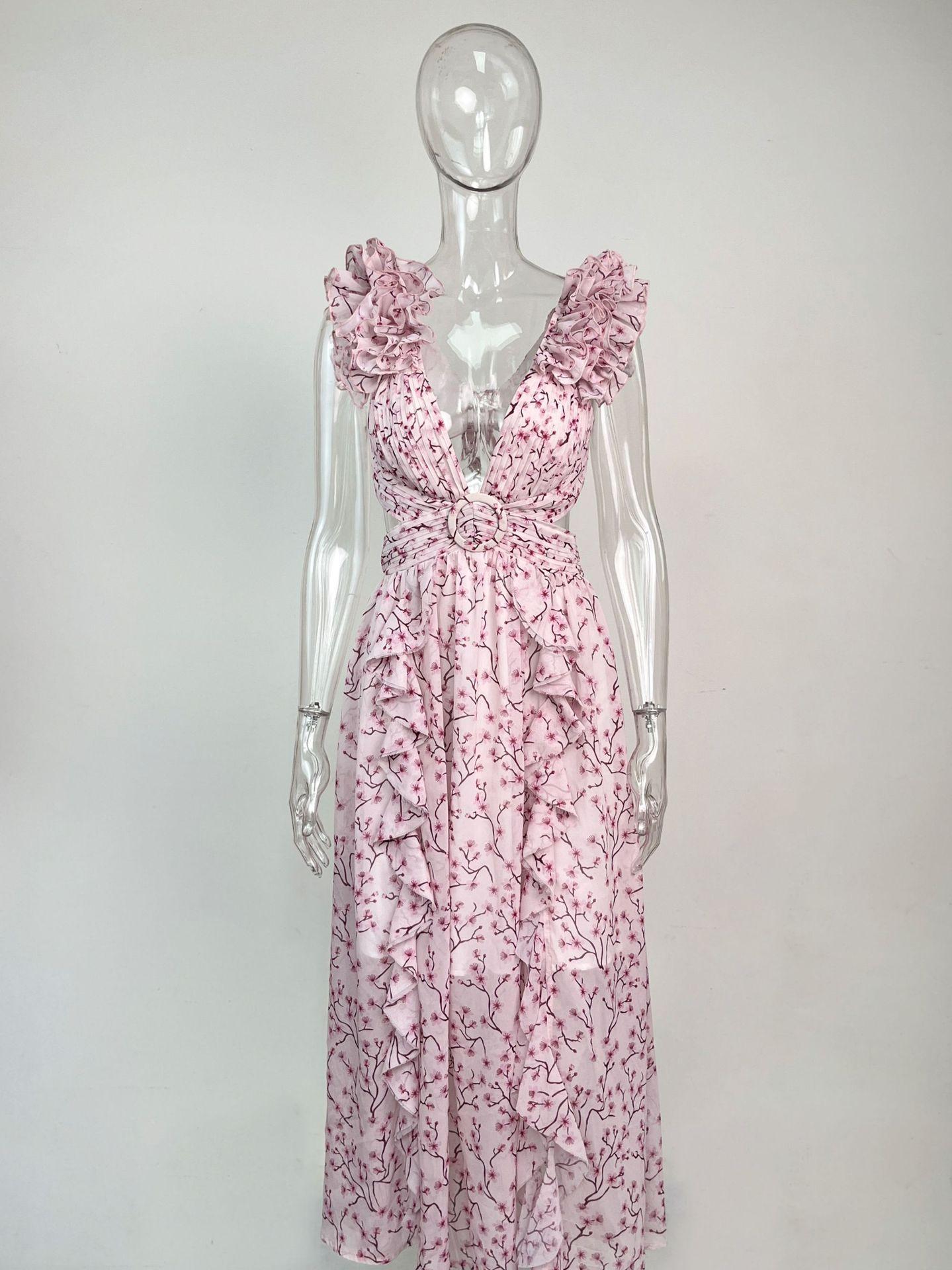 Mannequin wearing a pink floral dress against a white background
