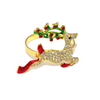 Gold reindeer-shaped bracelet with red and green accents on a white background