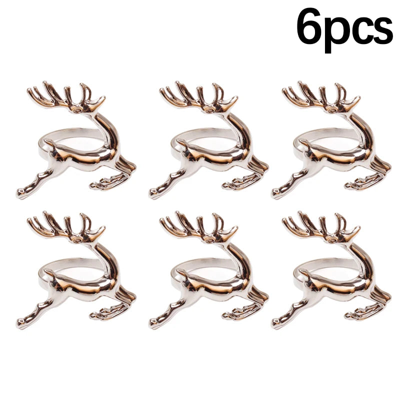 Set of six rose gold deer antler-shaped rings on a white background