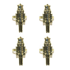 Four gold and black nutcracker-shaped rings on a white background
