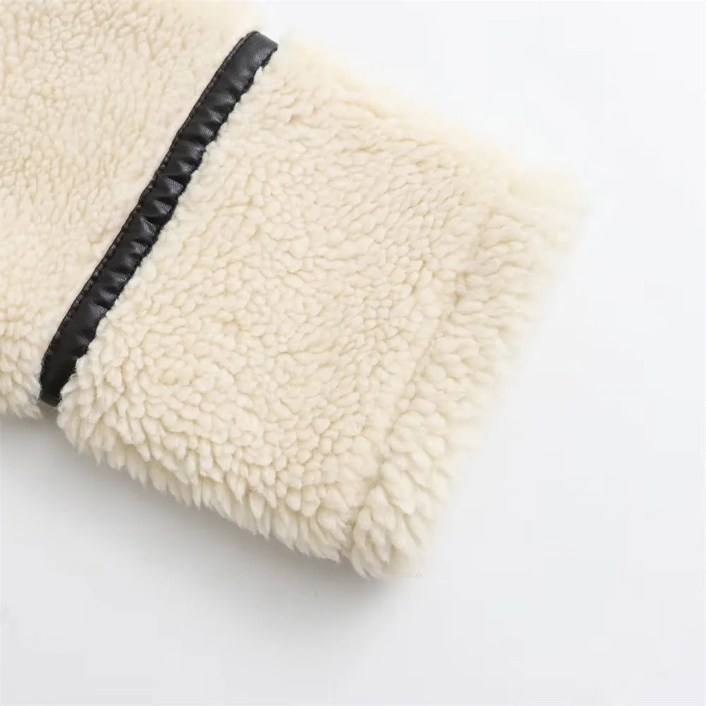 Close-up of a textured white pillow with a black stripe on a light gray background