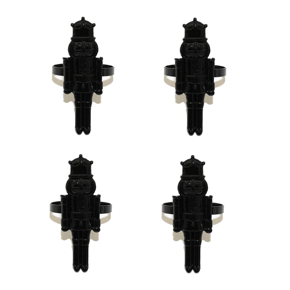 Four black nutcracker-shaped hair clips on a white background
