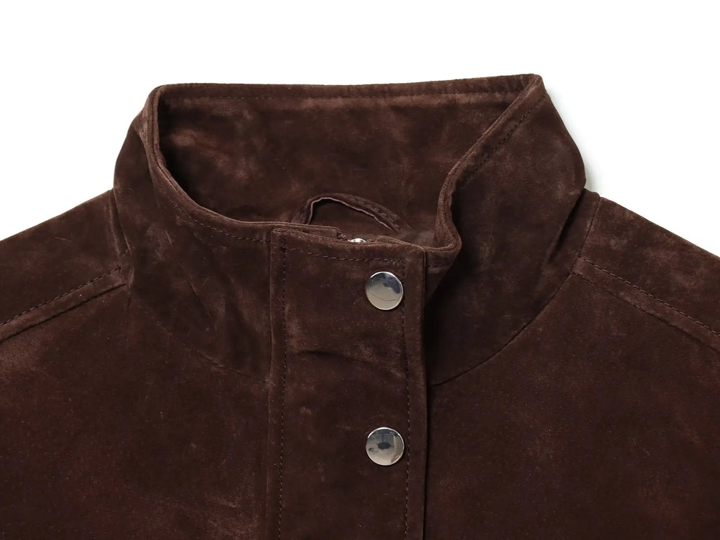 Close-up of a brown suede jacket with buttons on a white background