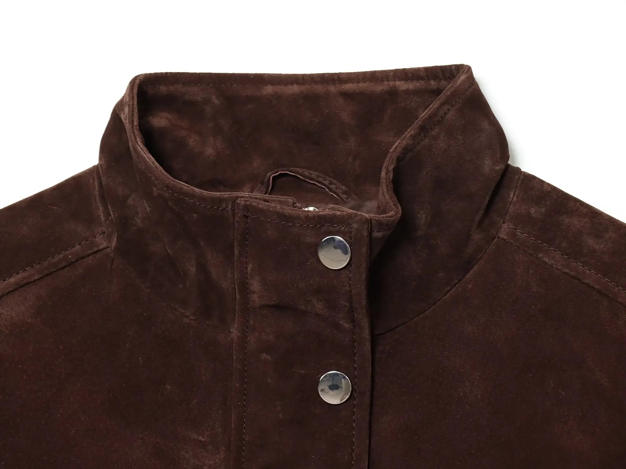 Close-up of a brown suede jacket with buttons on a white background