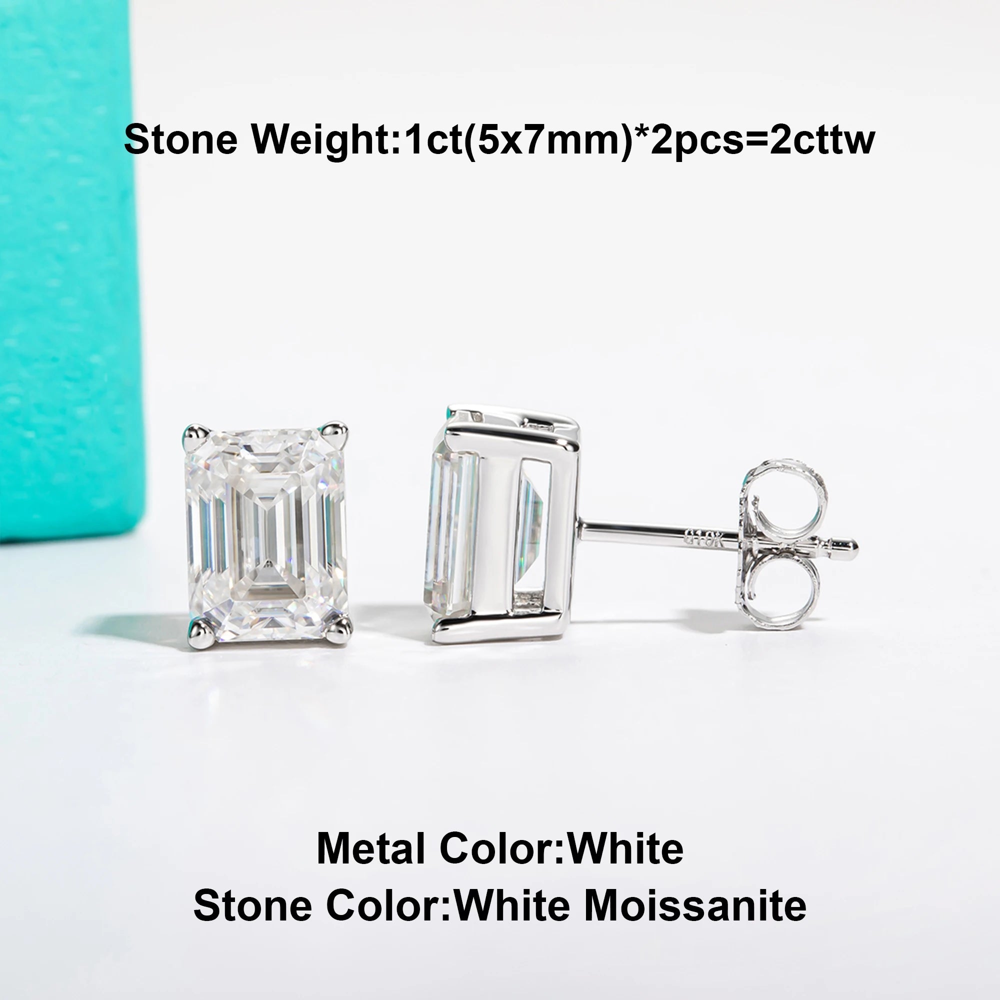 Pair of silver emerald-cut moissanite earrings on a white background with text indicating stone weight and color.