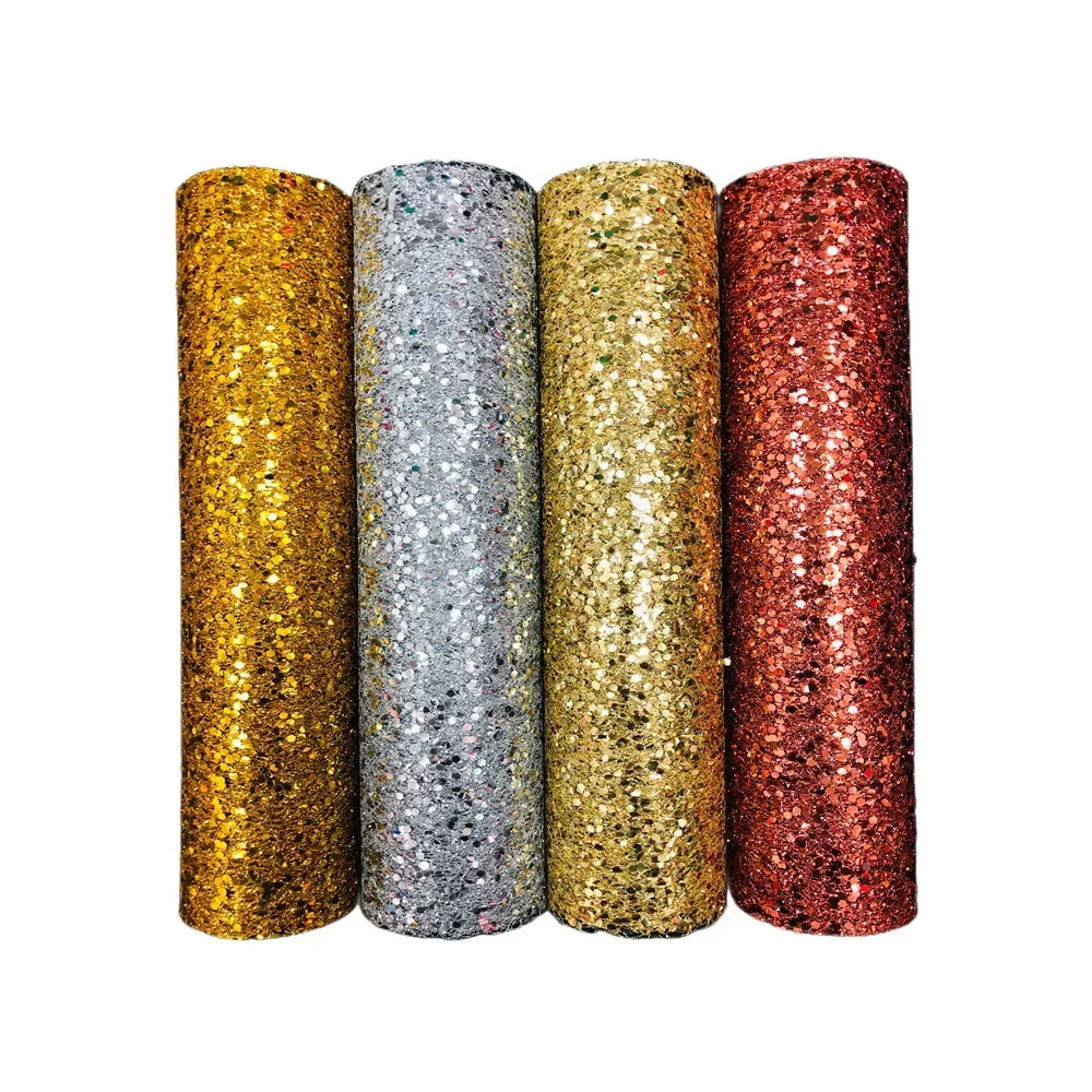 Four rolls of glittery material in gold, silver, bronze, and rose gold on a white background.