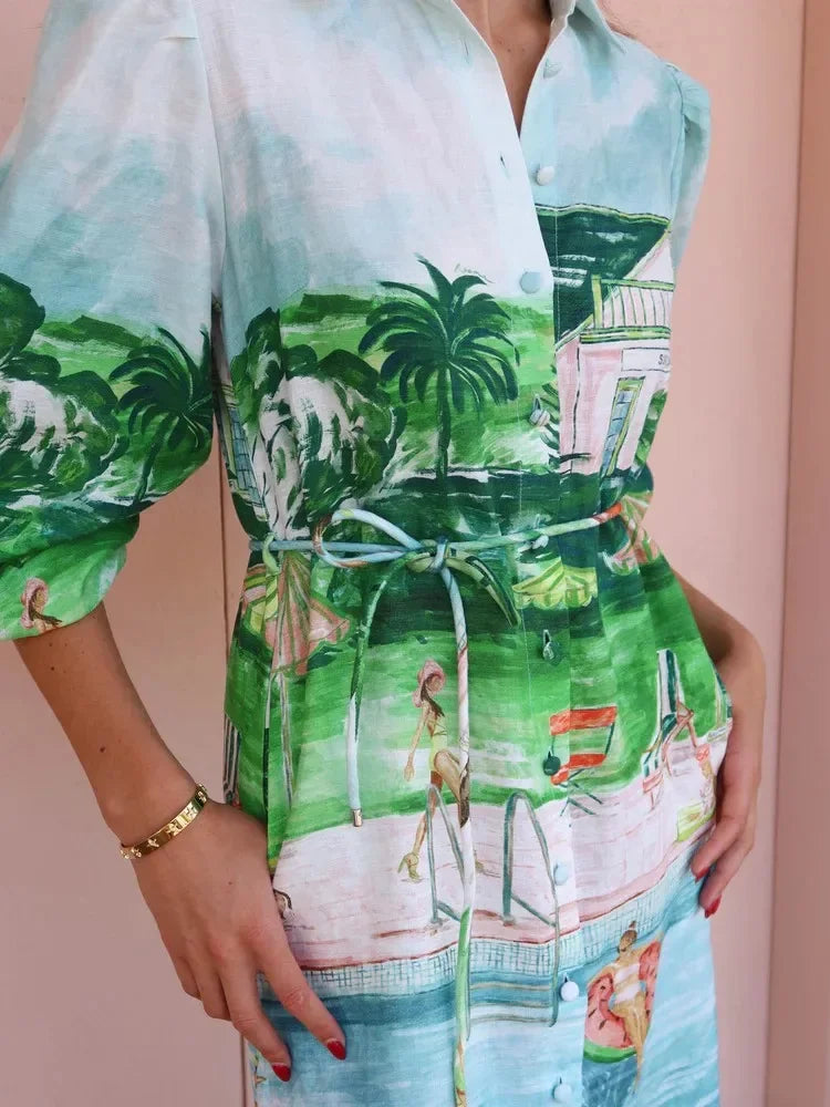 Person wearing a colorful dress with a tropical print on a beige background