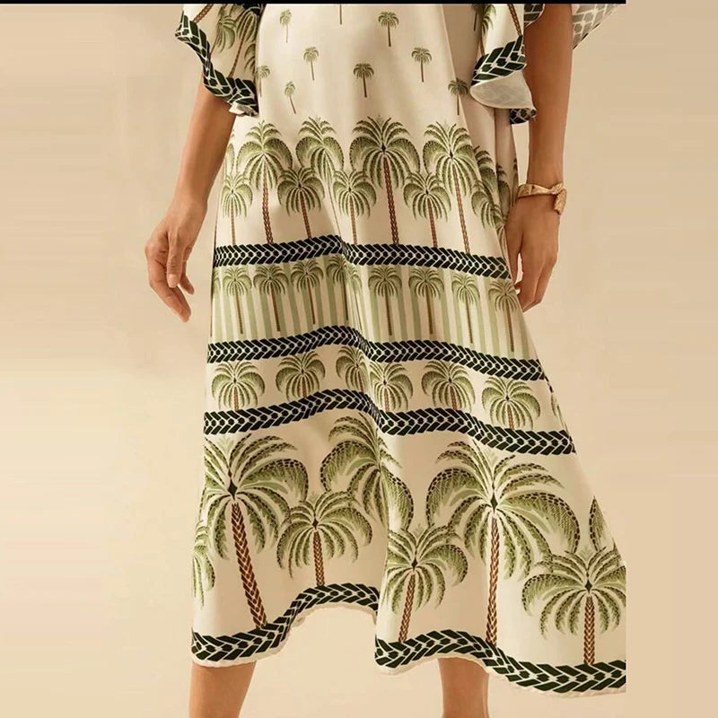 Dress with palm tree pattern on a beige background