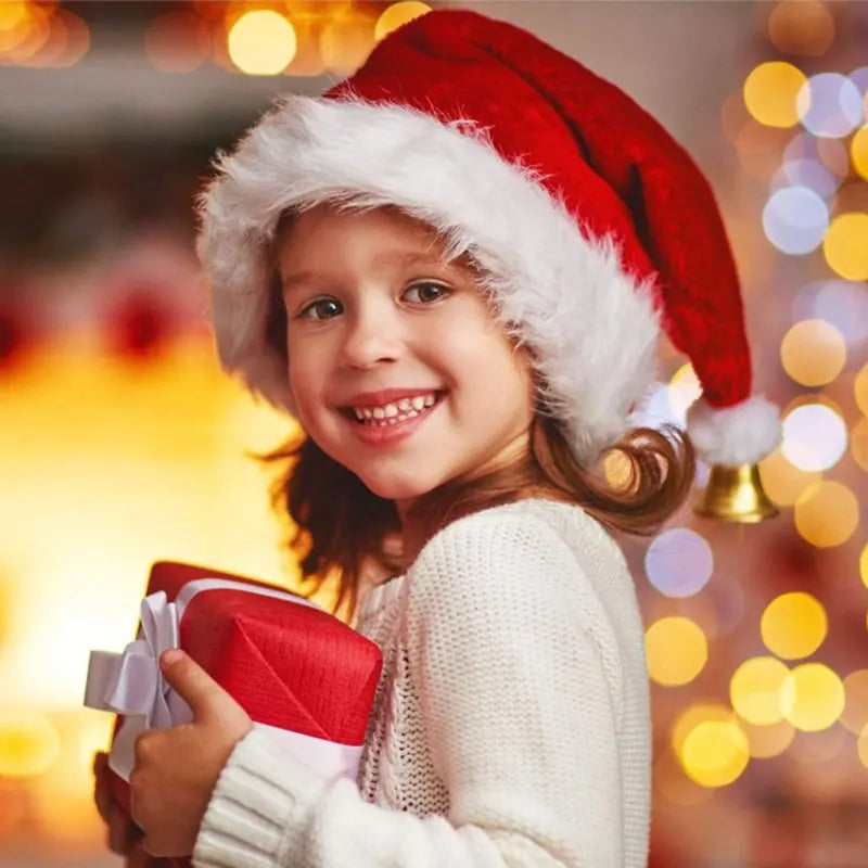 Child wearing a Santa hat holding a gift with a festive background