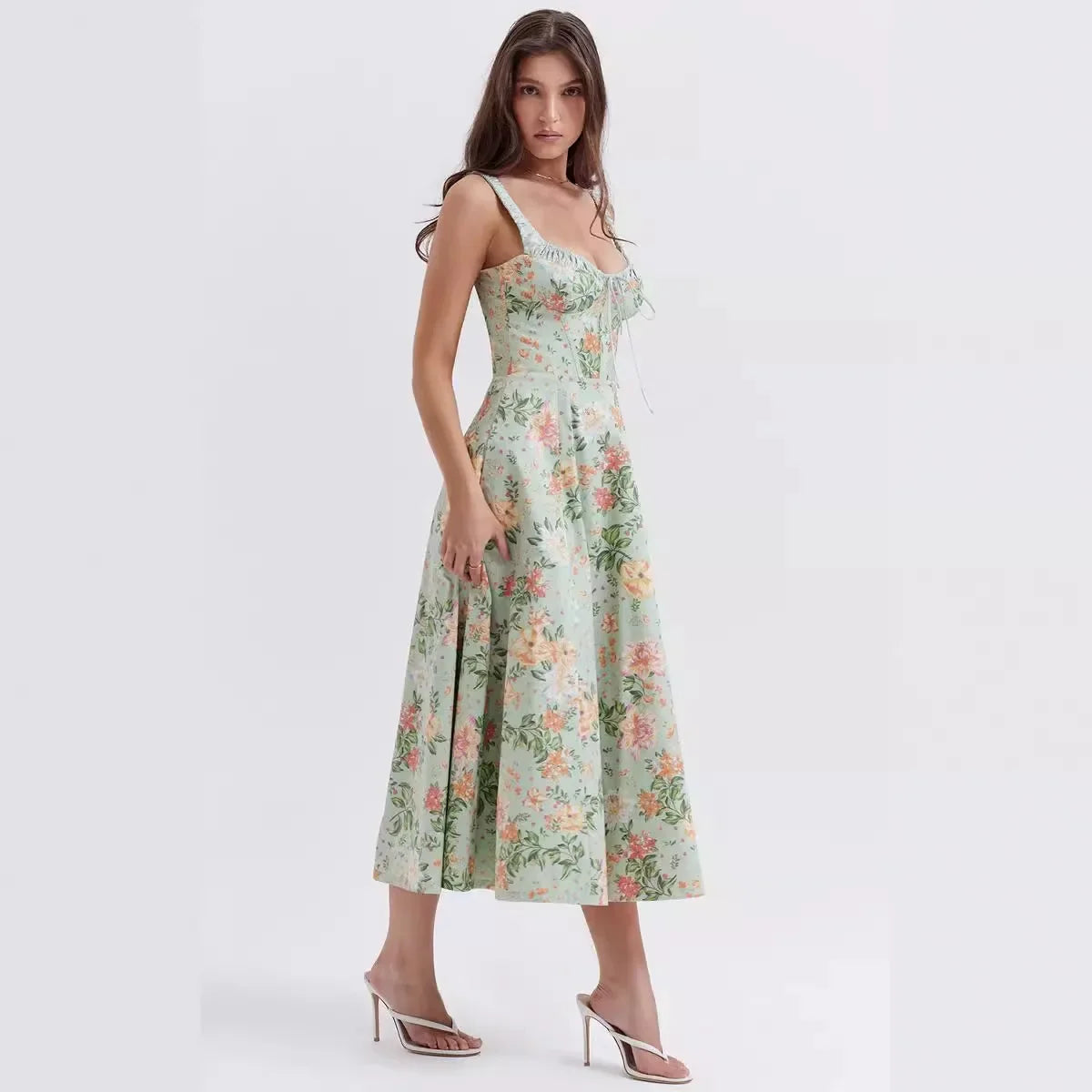 Woman wearing a floral dress on a white background