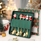 Set of gold Christmas-themed spoons in a decorative box with a festive background.