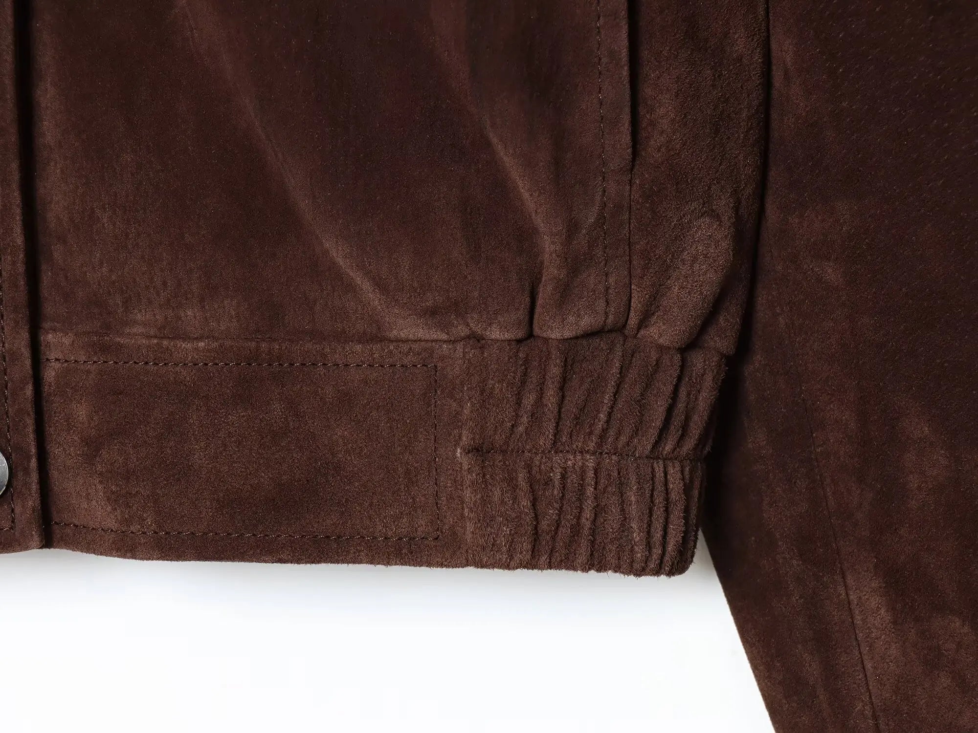Close-up of a brown jacket with a white background