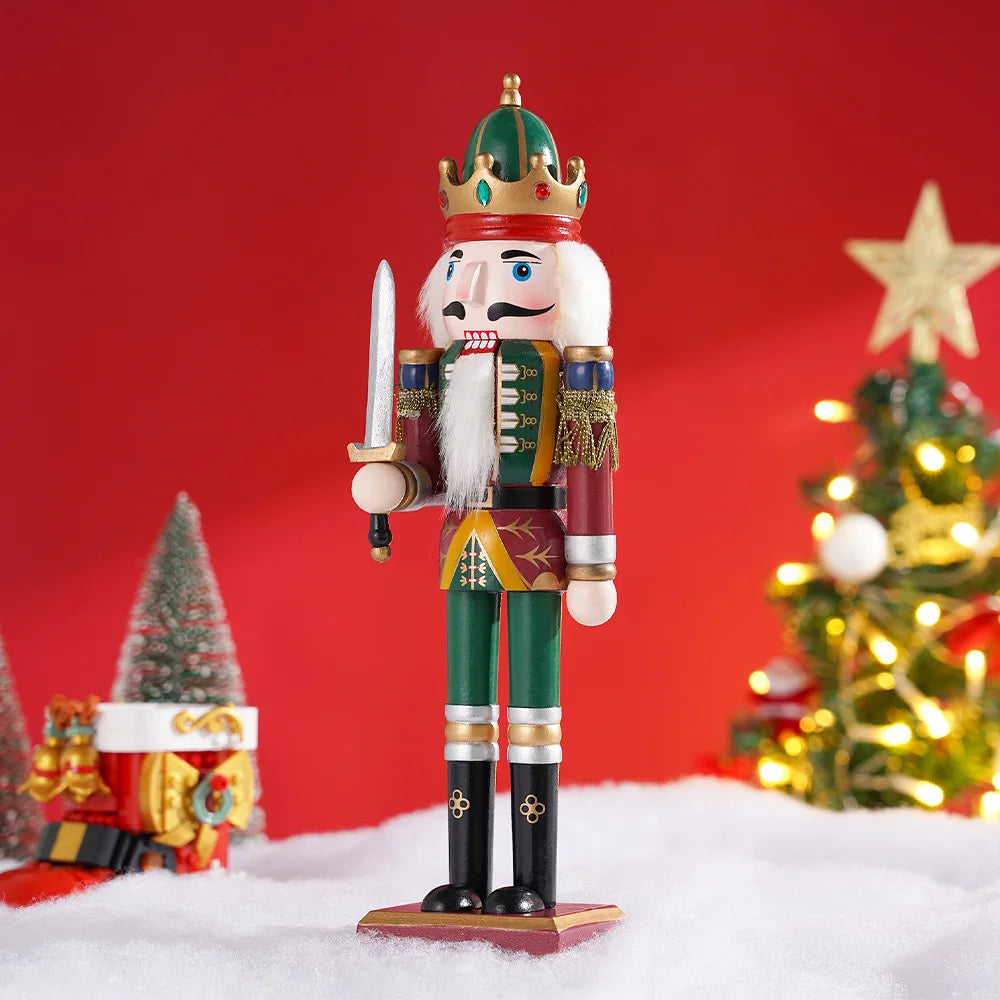 Decorative nutcracker figure with a crown in front of a Christmas tree and presents on a red background
