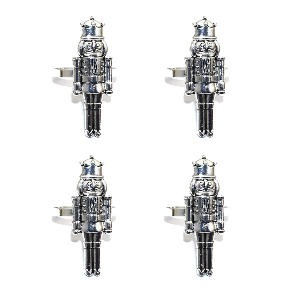 Four silver nutcracker-shaped bottle stoppers on a white background