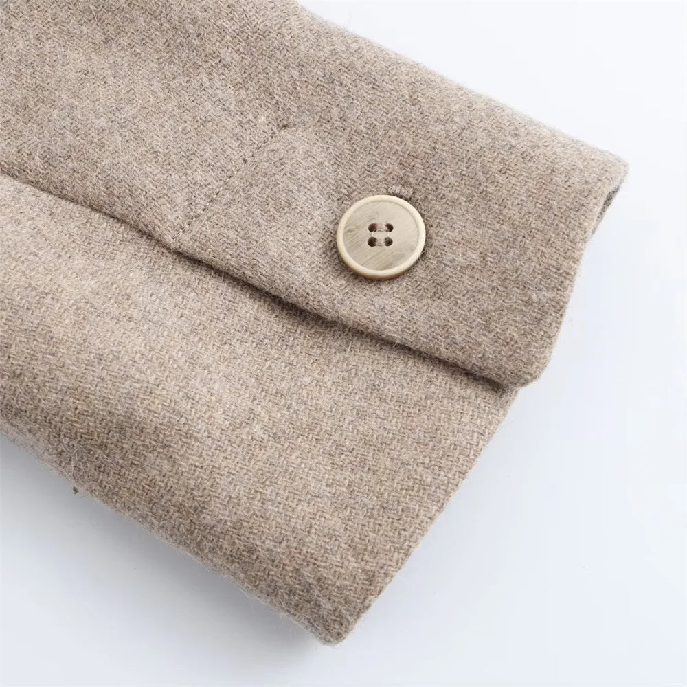Beige fabric pouch with a button on a white background