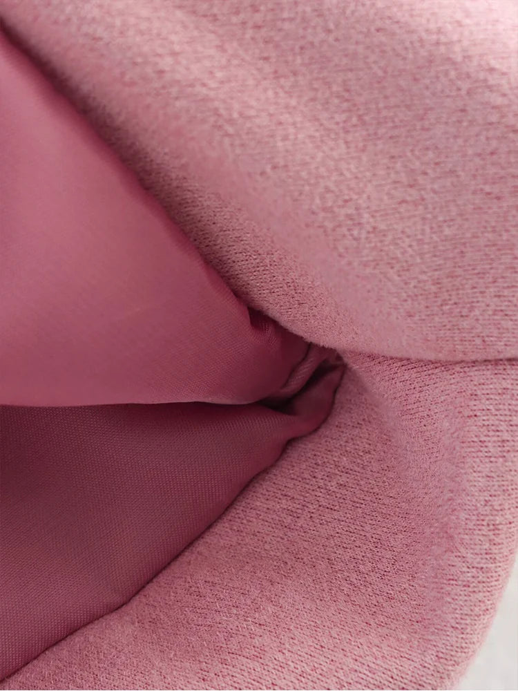 Close-up of pink fabric with a textured surface