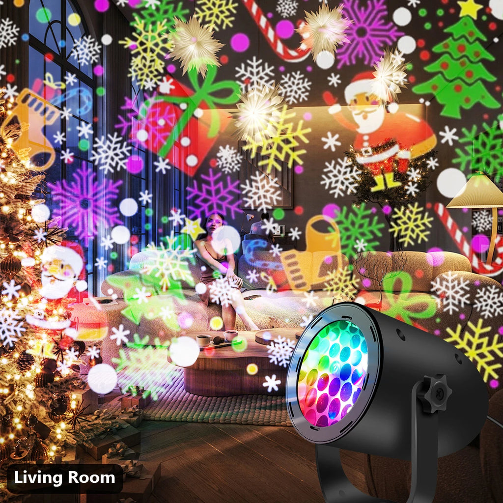 Living room decorated with Christmas-themed window clings and a colorful light projector.
