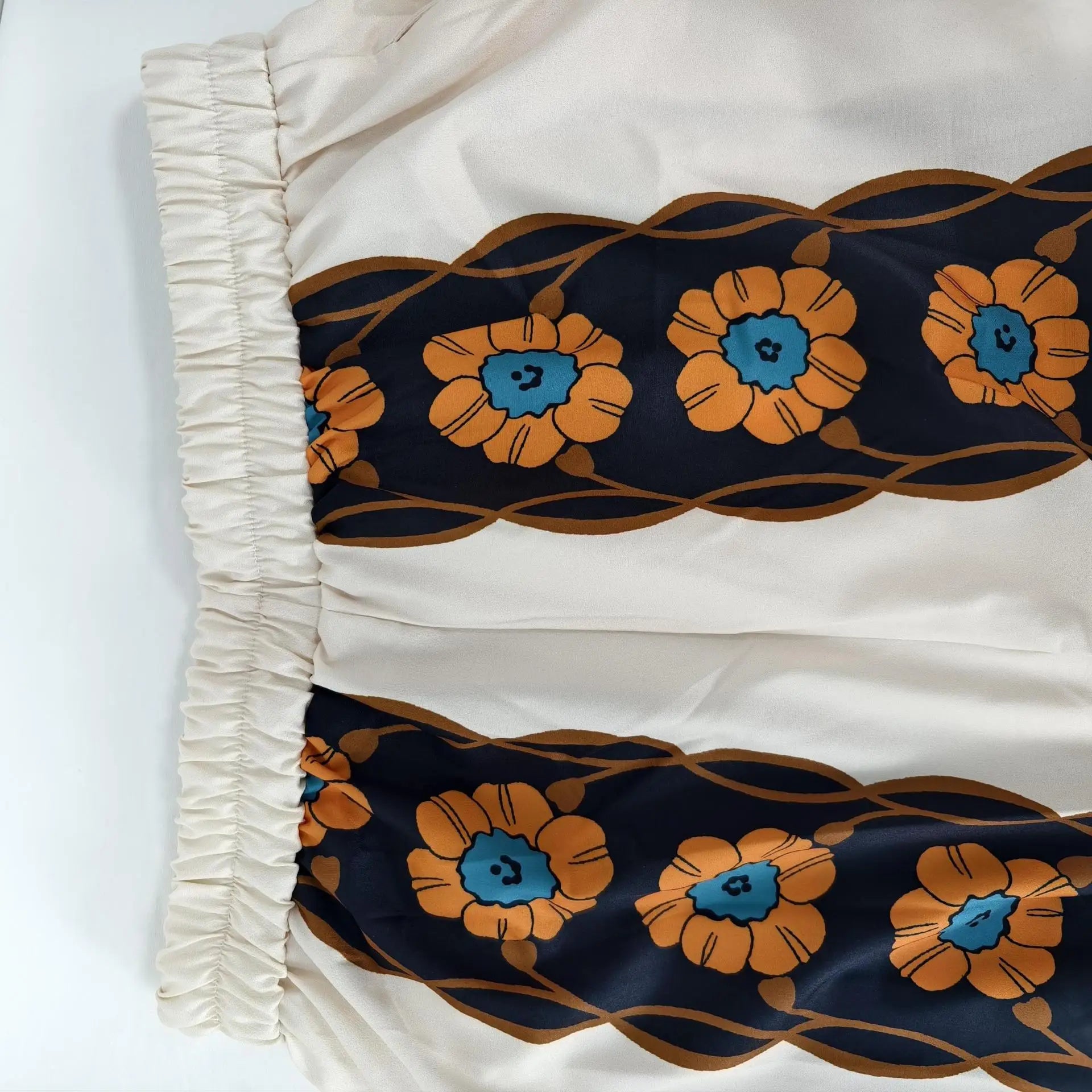 Close-up of a fabric with floral pattern on a white background