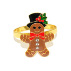 Gingerbread man ring with gold band, red bow tie, and top hat with holly on a white background