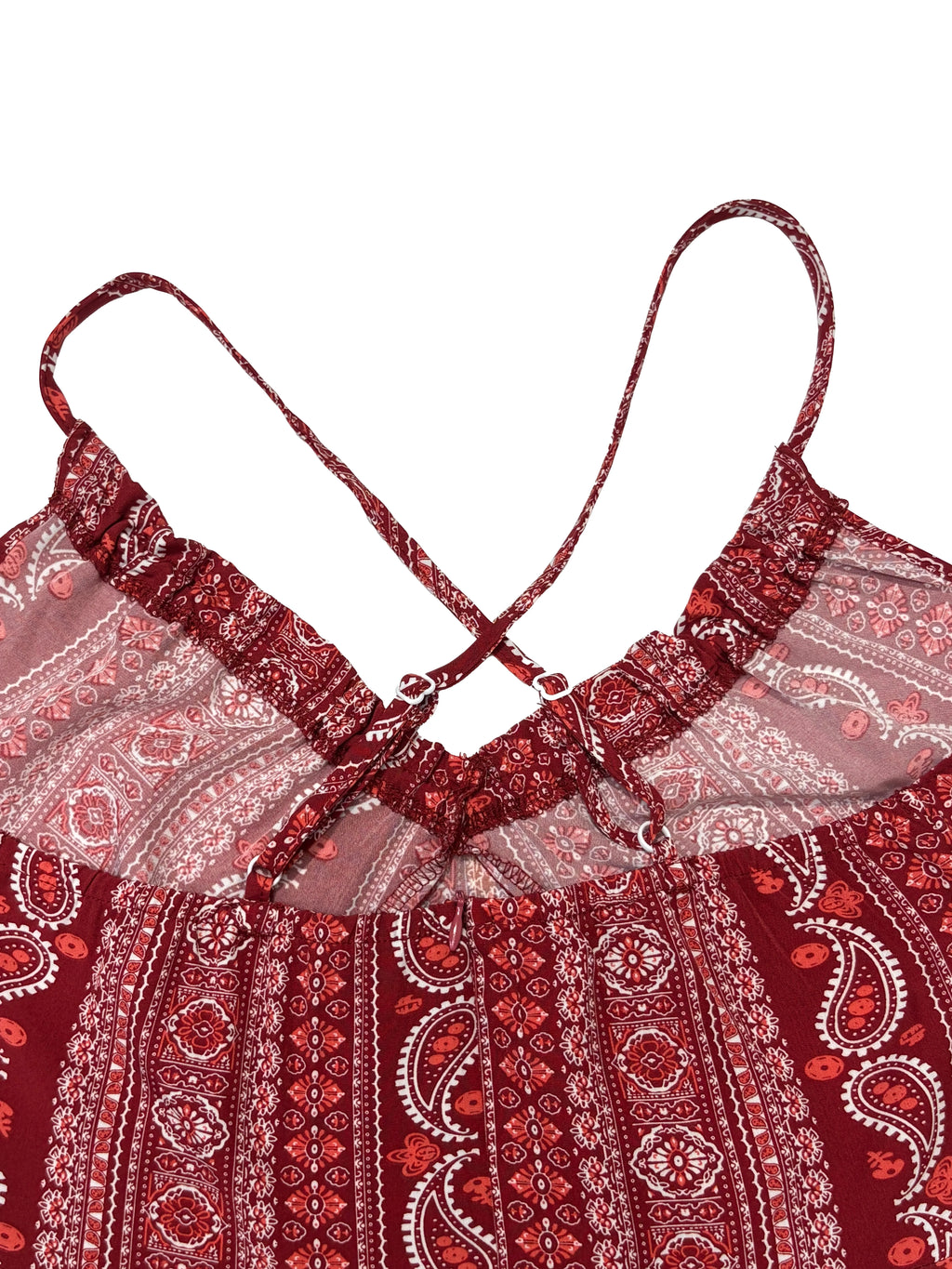 Red patterned top with thin straps on a white background