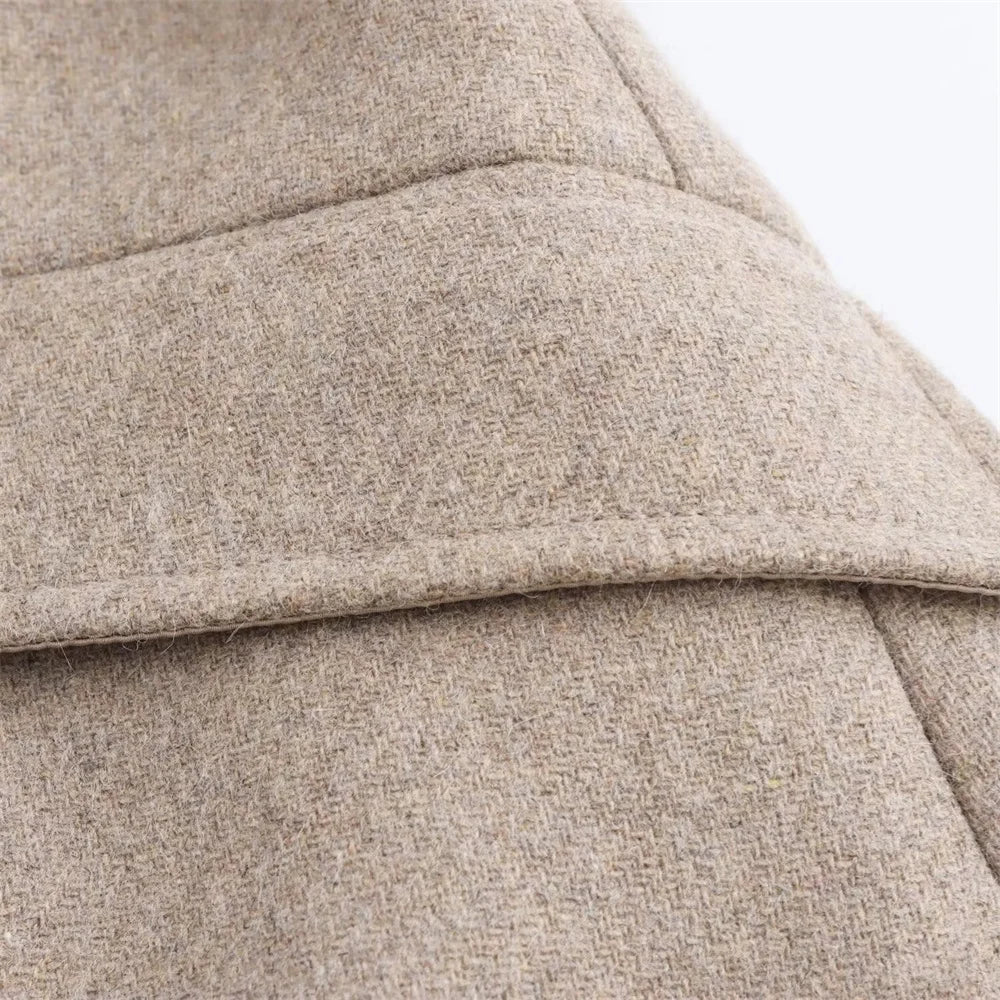 Close-up of a textured beige fabric surface