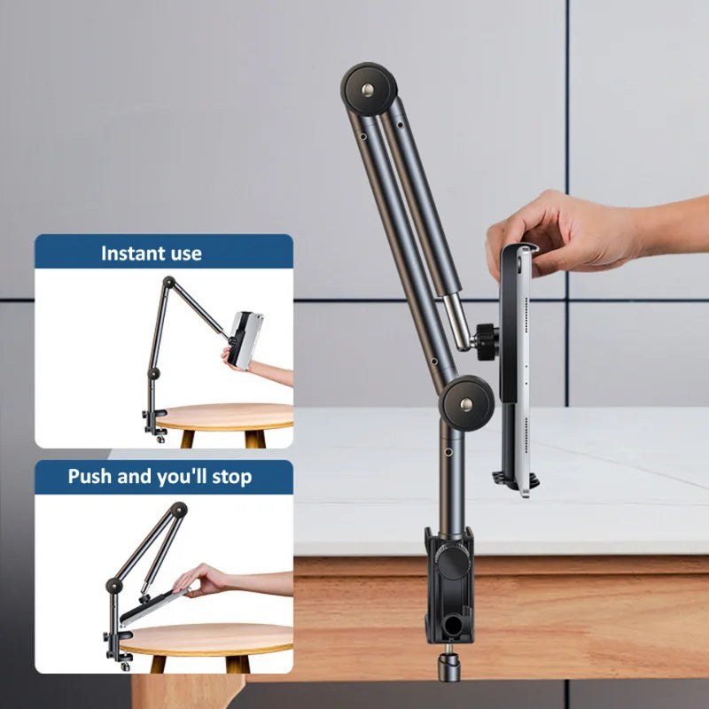 Adjustable desk mount with a hand demonstrating its use, set against a neutral background.