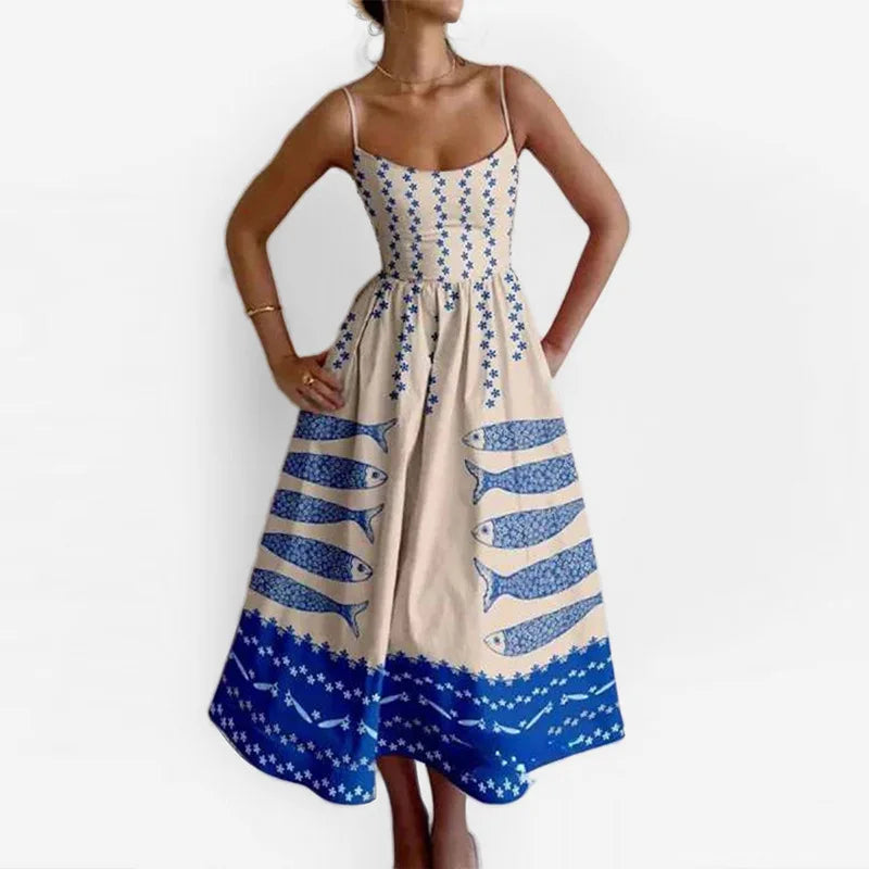 Dress with blue fish pattern on a white background