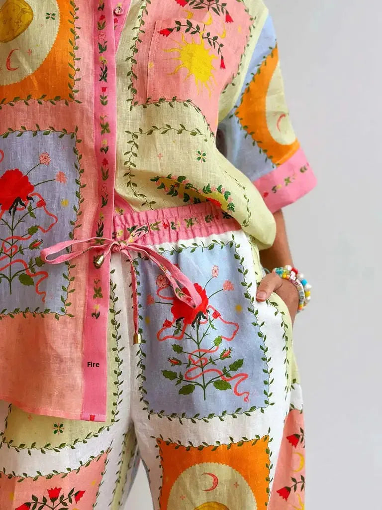 Colorful embroidered outfit with a patchwork pattern on a plain background