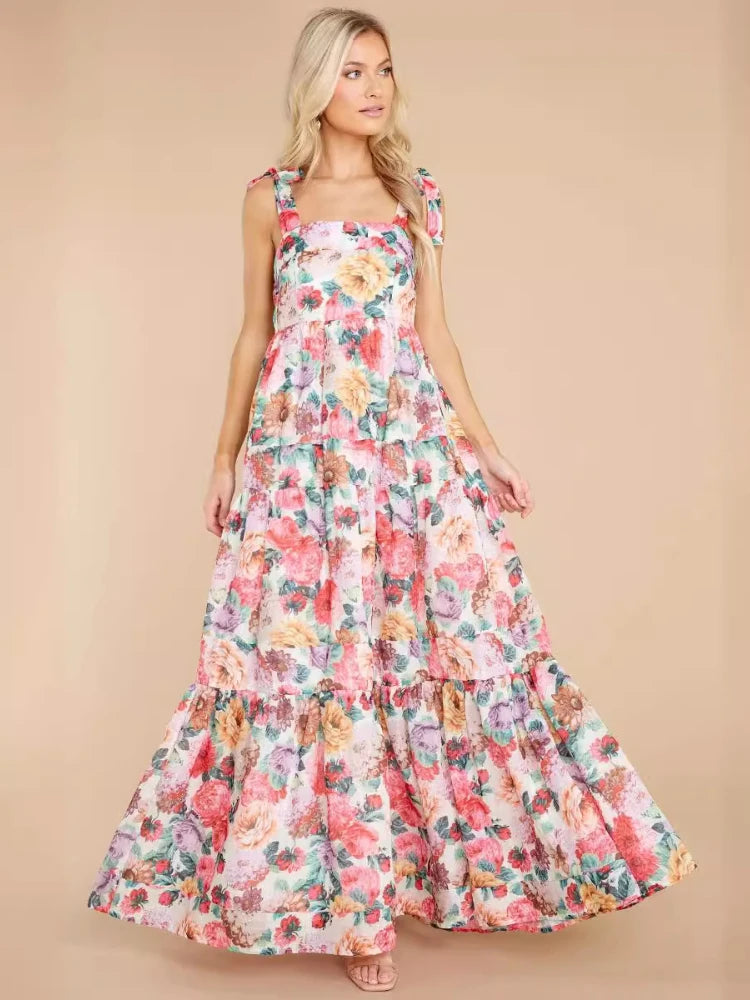 Woman wearing a floral dress against a beige background