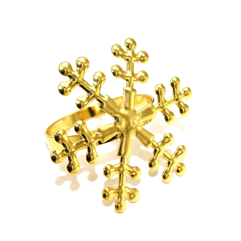 Gold snowflake-shaped ring on a white background