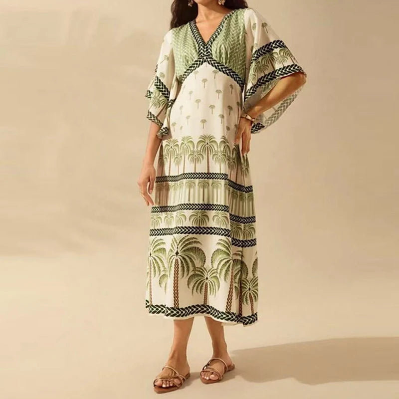 Woman wearing a palm tree patterned dress on a beige background