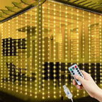 Decorative LED string lights with a remote control in front of a house.