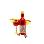 Decorative ring with red wine bottle and glass design on a white background