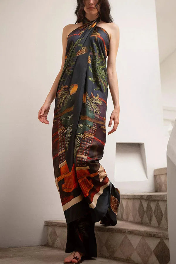 Woman wearing a long, patterned dress standing on a staircase.