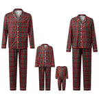 Red and black plaid pajama sets for adults and children on a white background