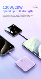 Two smartphones connected to a charging cable on a light purple background