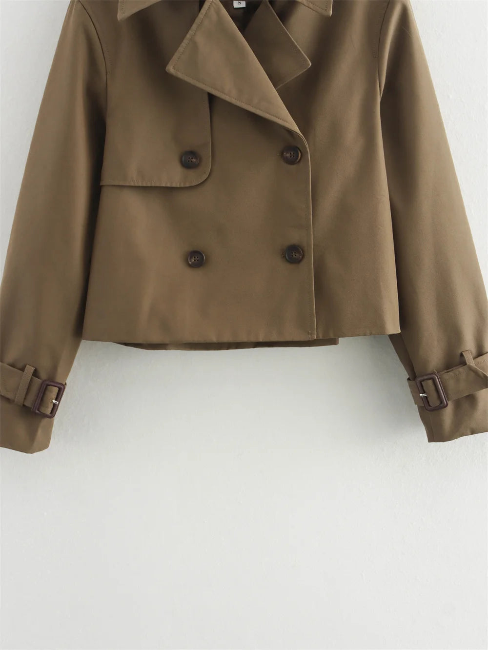 Brown coat with button details on a white background