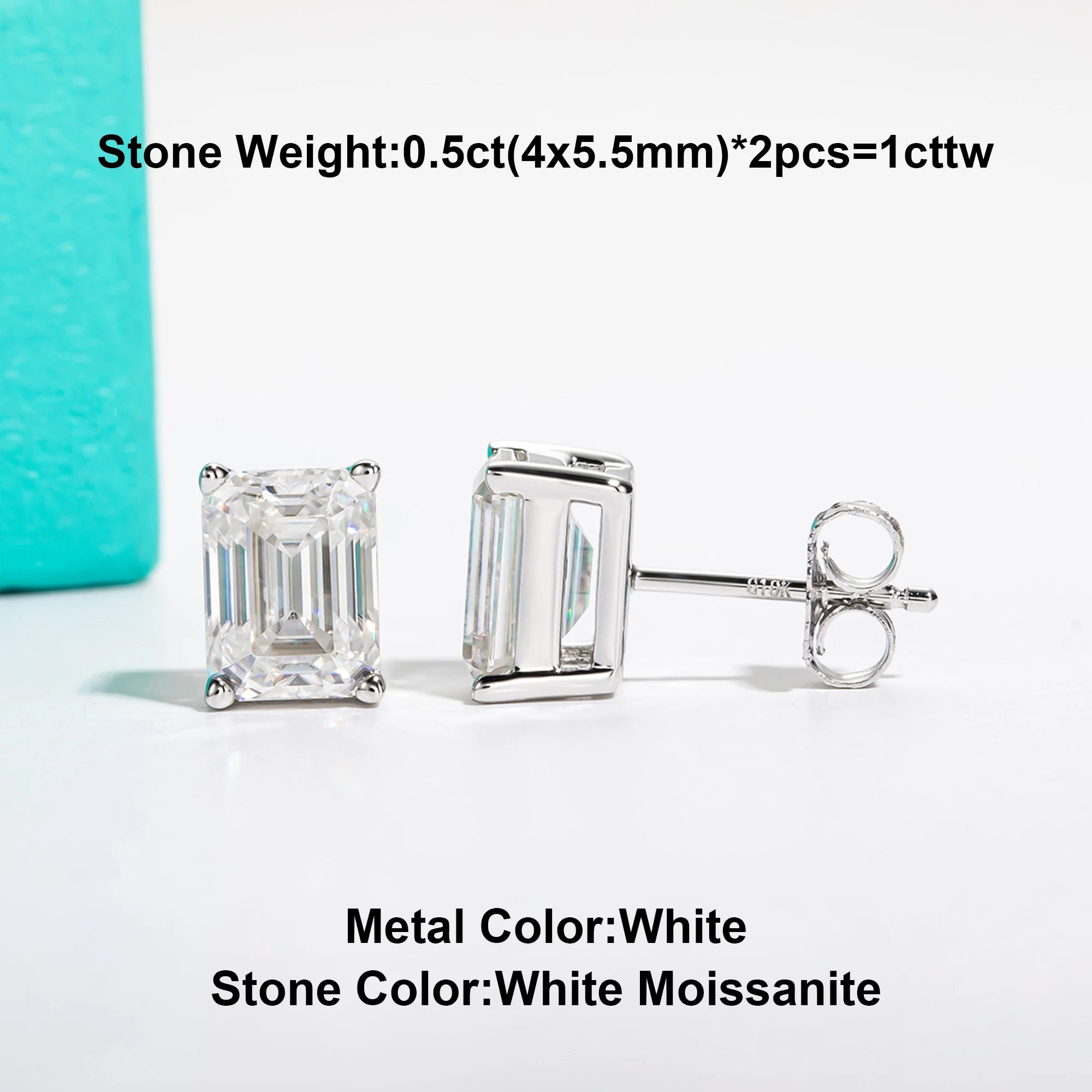 Pair of silver emerald-cut moissanite earrings on a light gray background with text detailing stone weight and color.