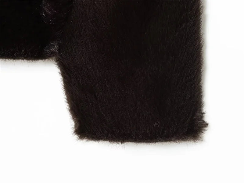 Close-up of black fur texture on a white background