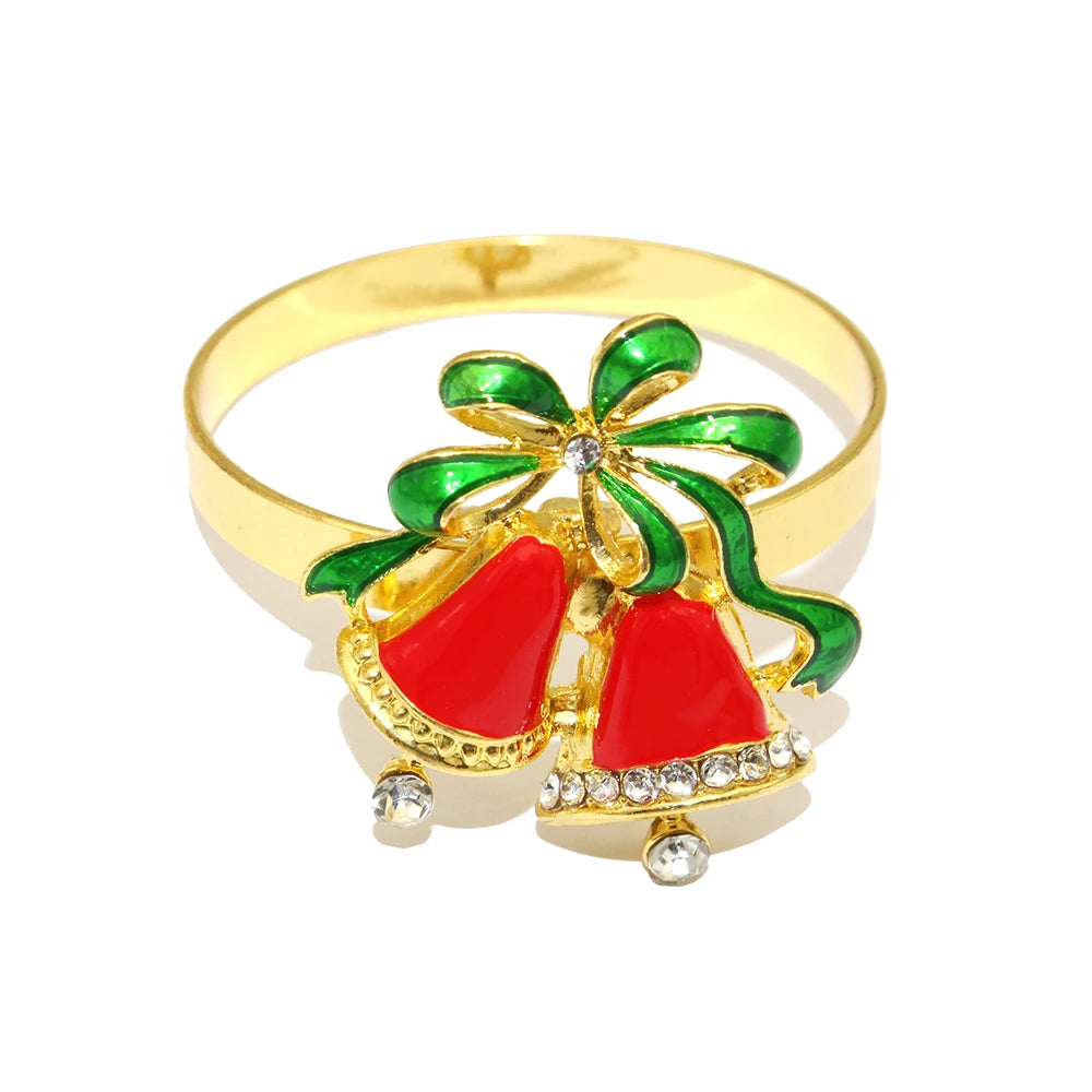 Gold ring with red and green design on a white background