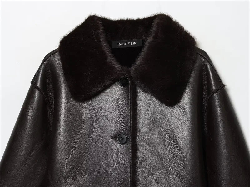 Black leather coat with fur collar on a white background