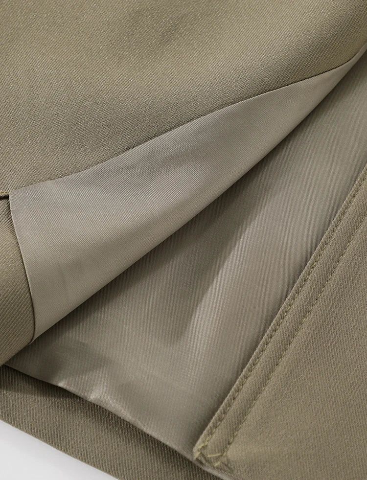 Close-up of beige fabric with a visible seam