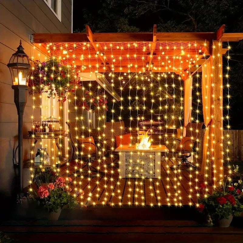 Outdoor patio with string lights, table, chairs, and decorative elements.