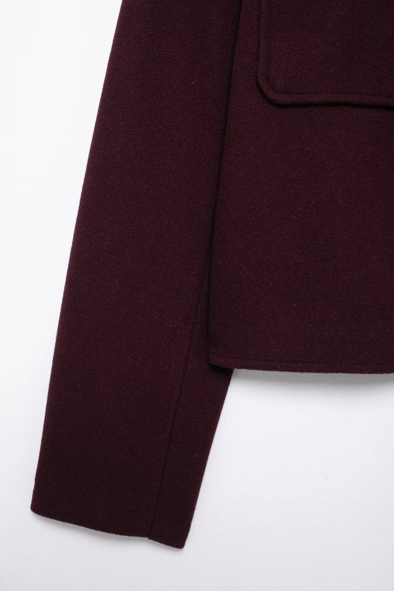 Close-up of a dark brown fabric on a white background