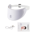White facial beauty device with USB cable and packaging on a white background